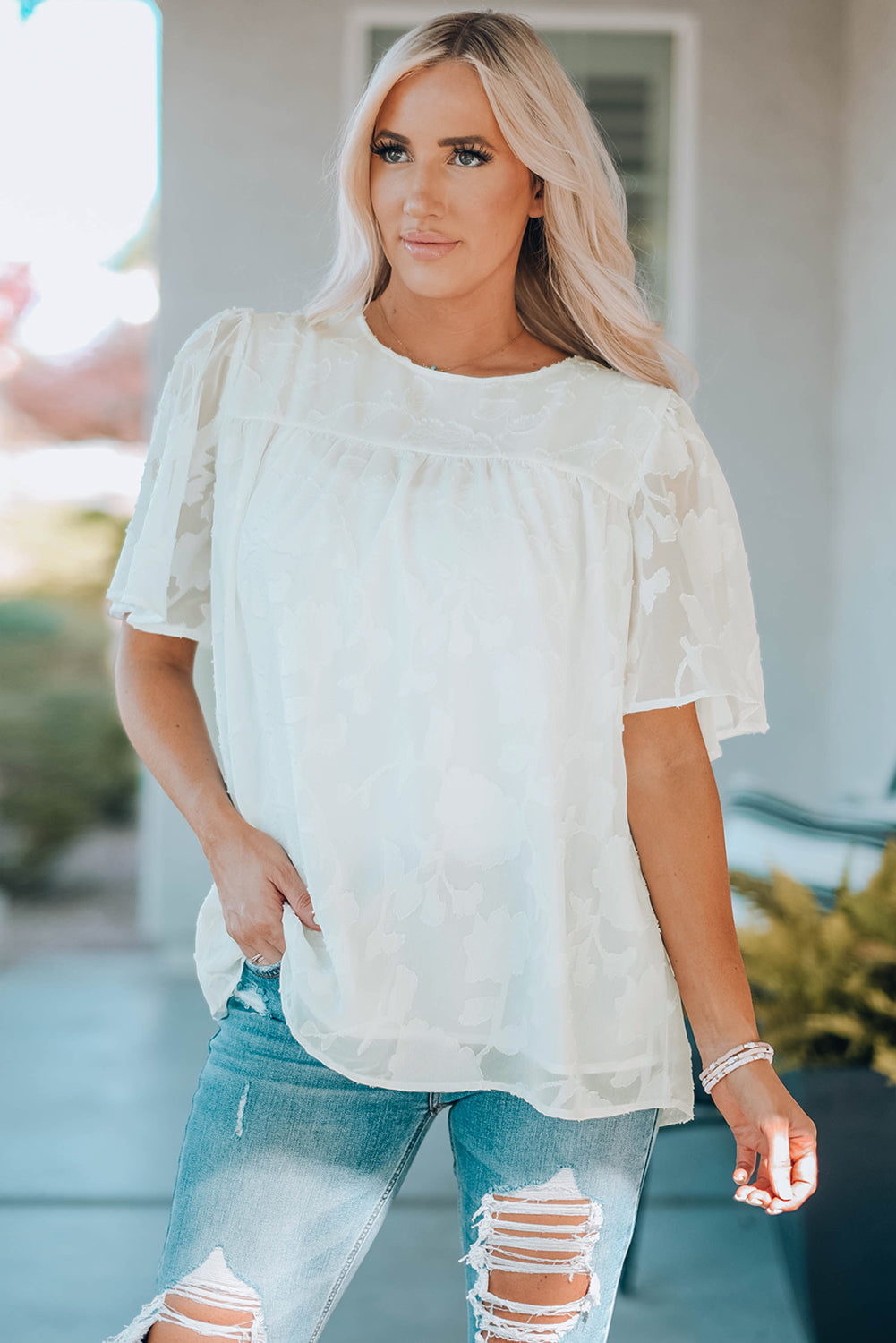 Blusa con cuello redondo y mangas abullonadas
