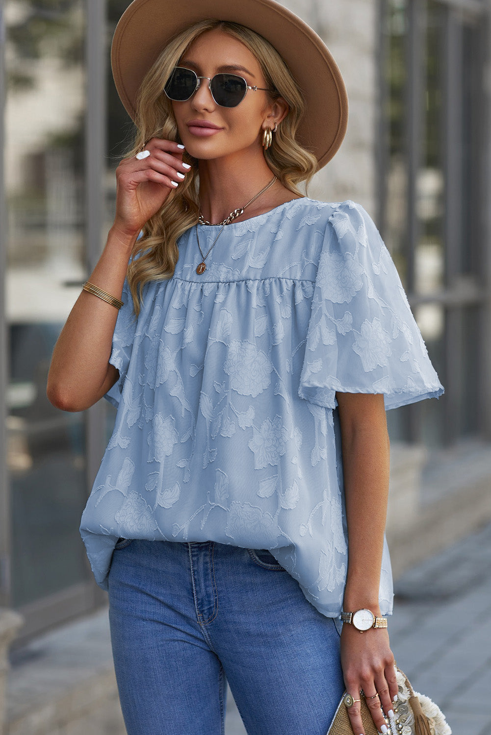 Blusa con cuello redondo y mangas abullonadas