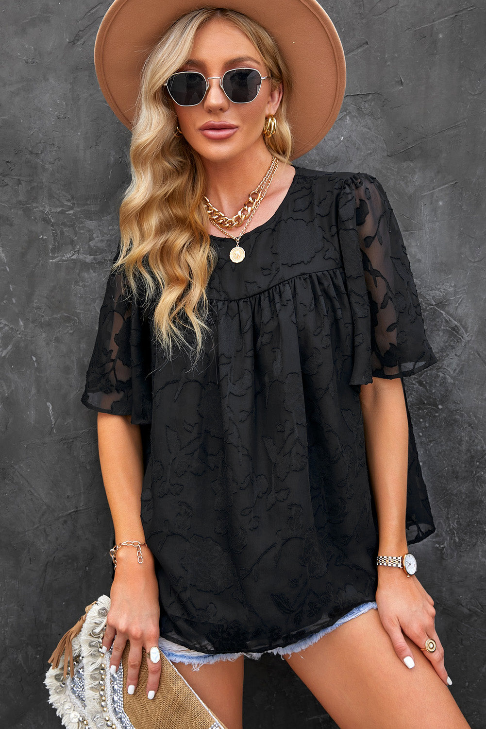 Blusa con cuello redondo y mangas abullonadas