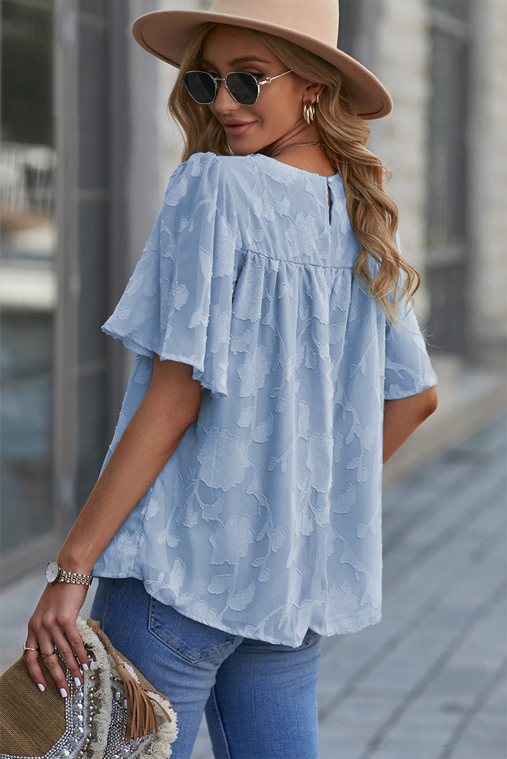 Blusa con cuello redondo y mangas abullonadas