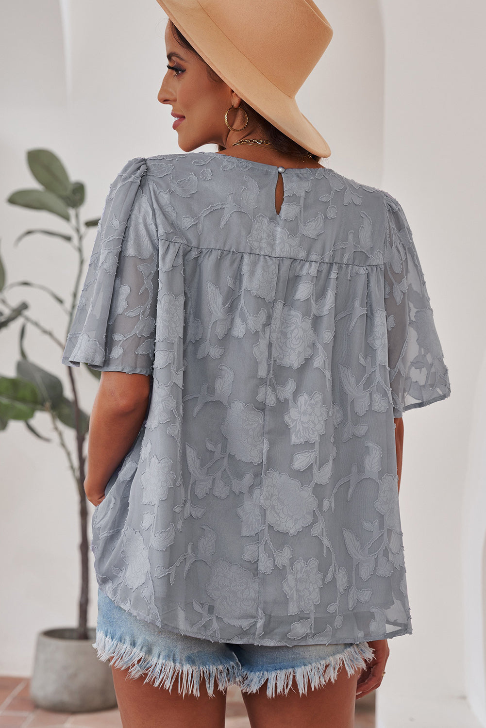 Blusa con cuello redondo y mangas abullonadas