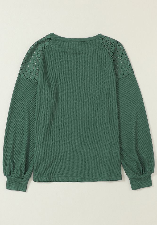 Blusa con cuello redondo, mangas farol y detalle de encaje