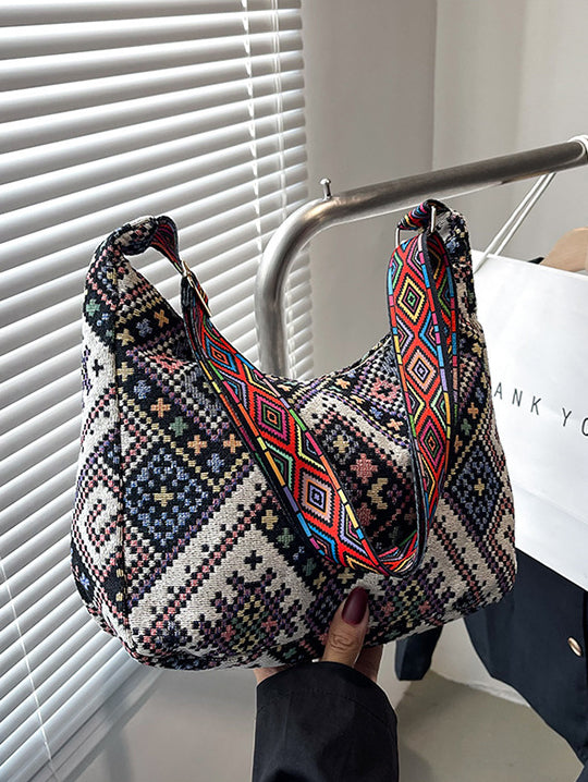 Bolso bandolera con correa ajustable y diseño geométrico