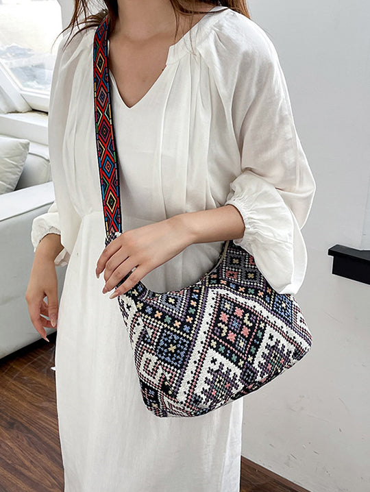 Bolso bandolera con correa ajustable y diseño geométrico
