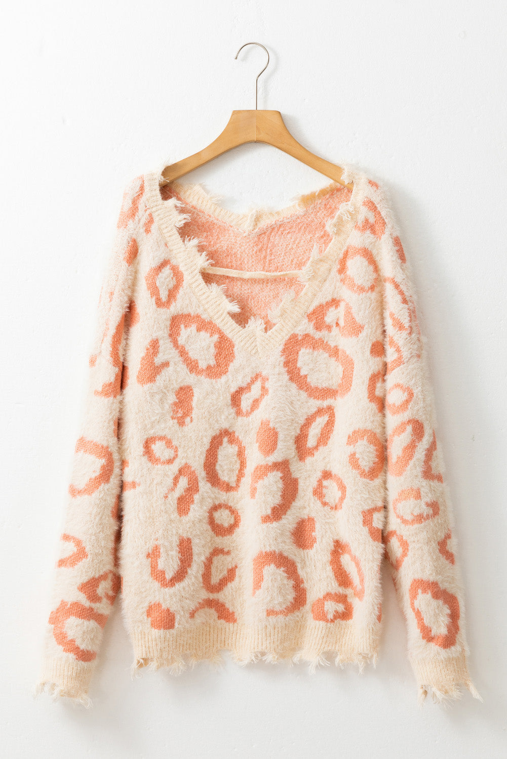 Suéter de cuello en V con estampado de leopardo y ribete desgastado