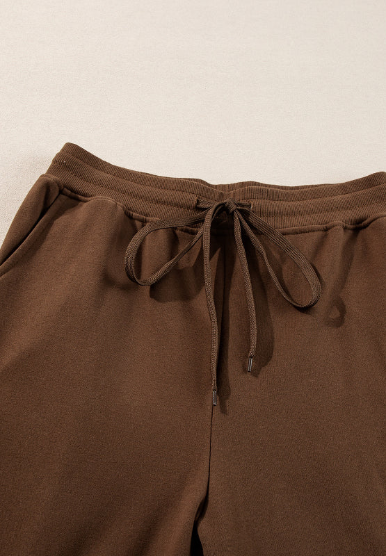 Conjunto de pantalón y top de manga larga con cuello redondo y abertura lateral