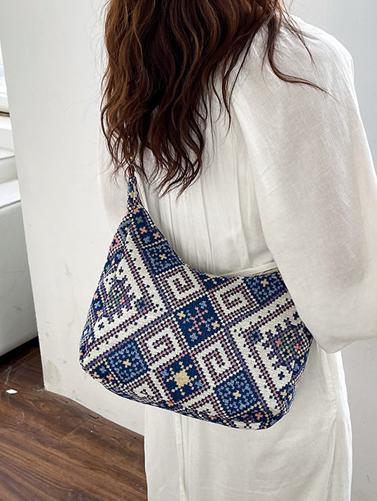 Bolso bandolera con correa ajustable y diseño geométrico