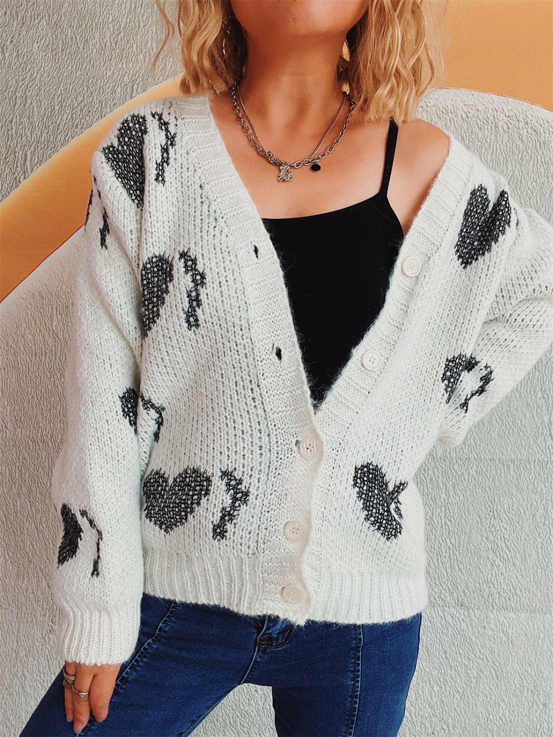 Cárdigan de manga larga con botones en forma de corazón