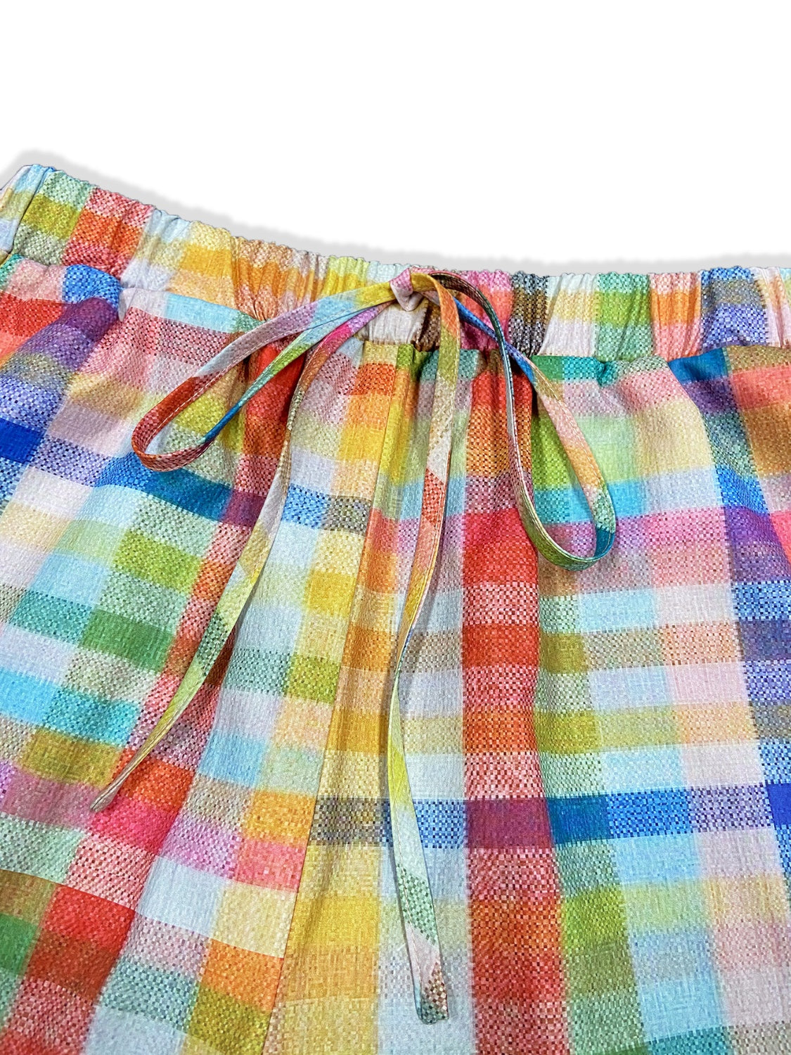 Pantalones a cuadros con bolsillos y lazos en contraste