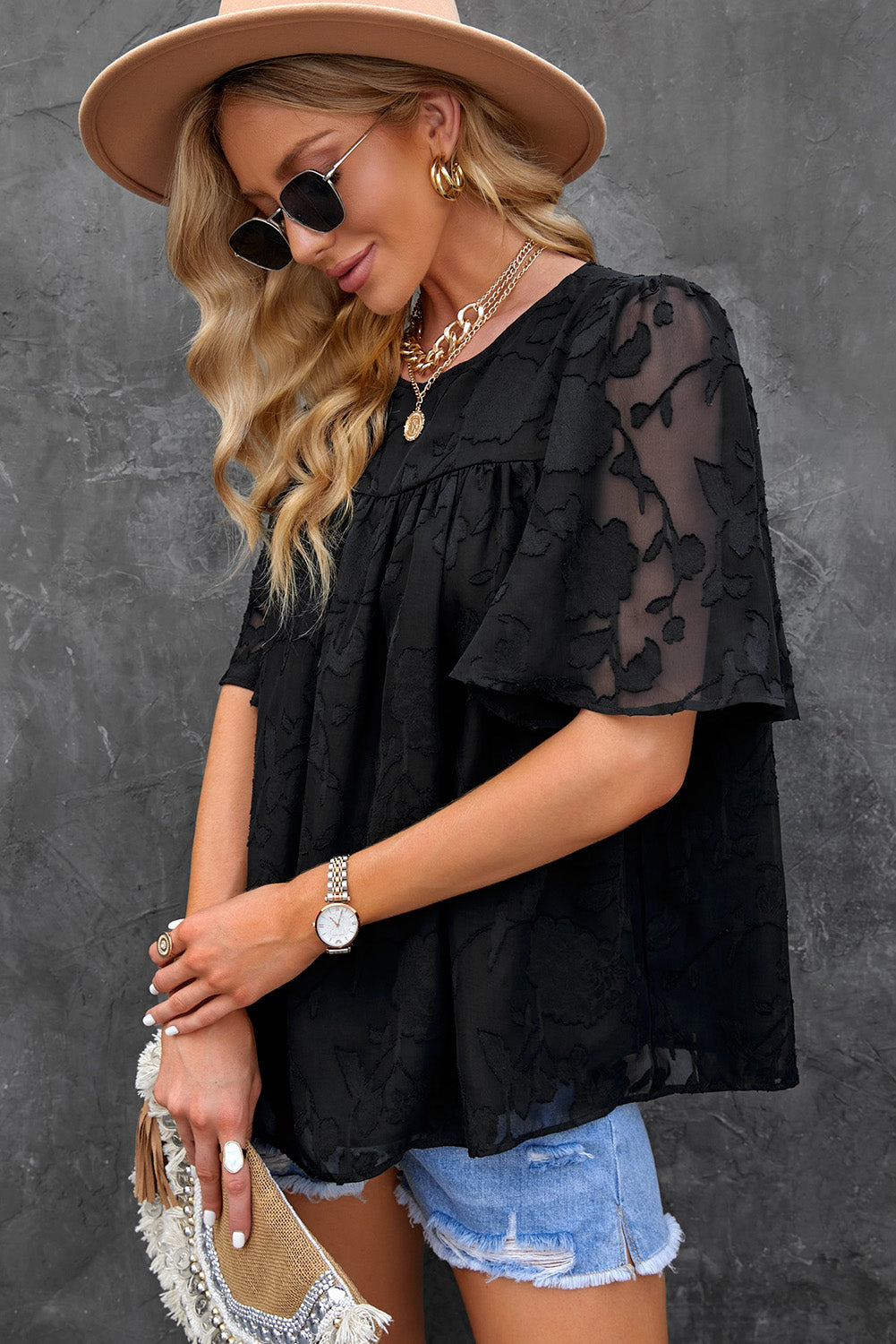 Blusa con cuello redondo y mangas abullonadas