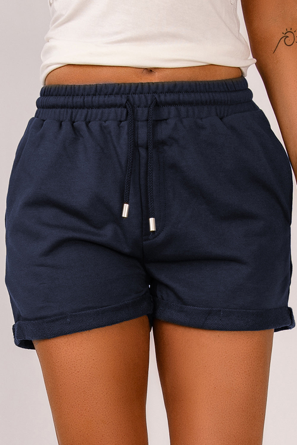Pantalones cortos con puños y cordón en la cintura