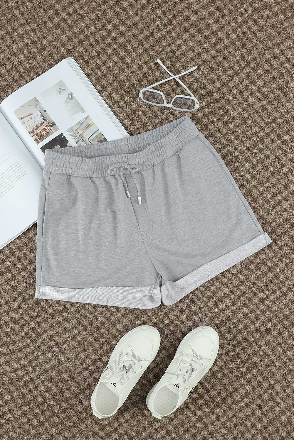Pantalones cortos con puños y cordón en la cintura